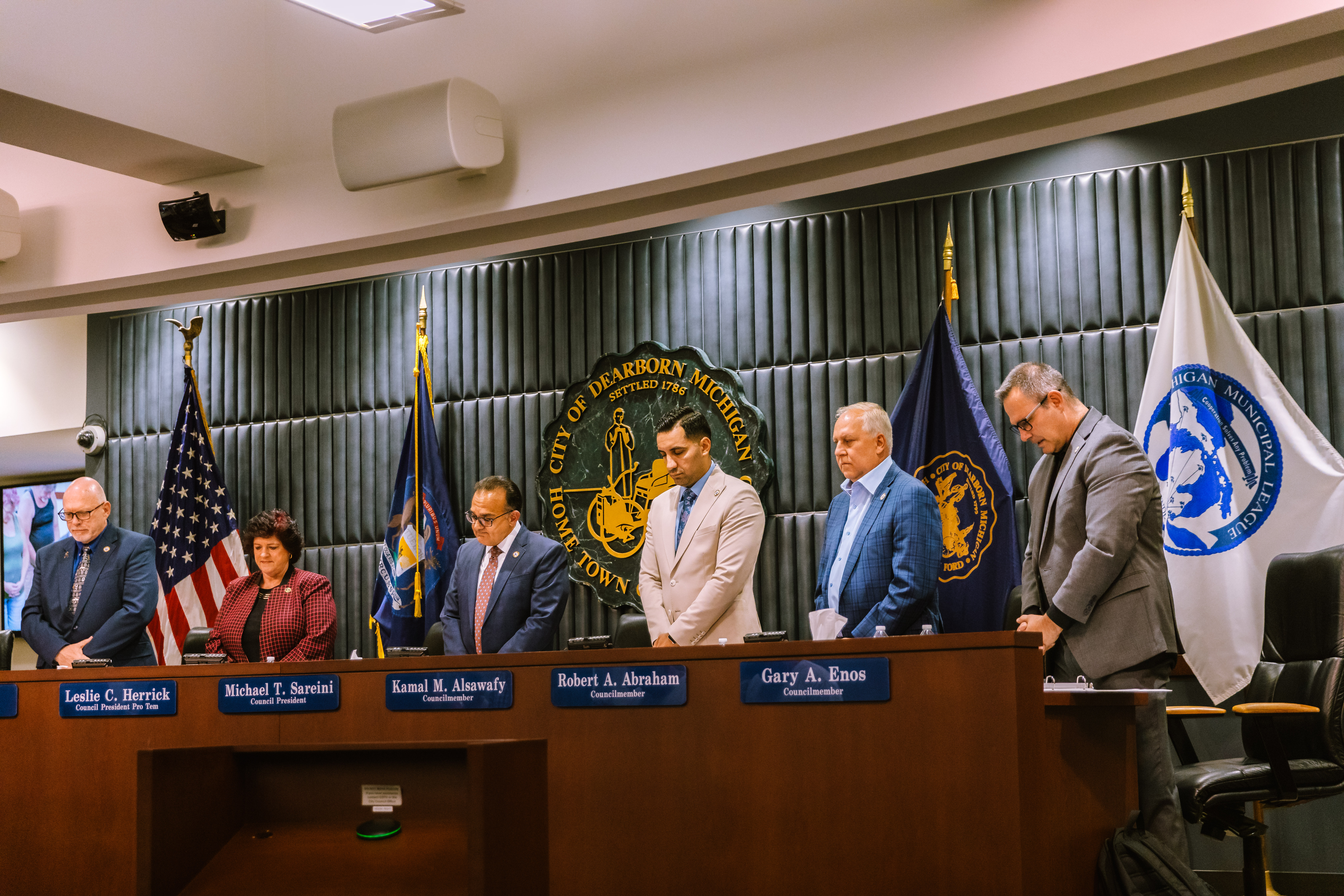 City Council members standing in Chambers